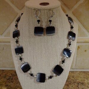 Handcrafted necklace and earring set in black, gray, and silver